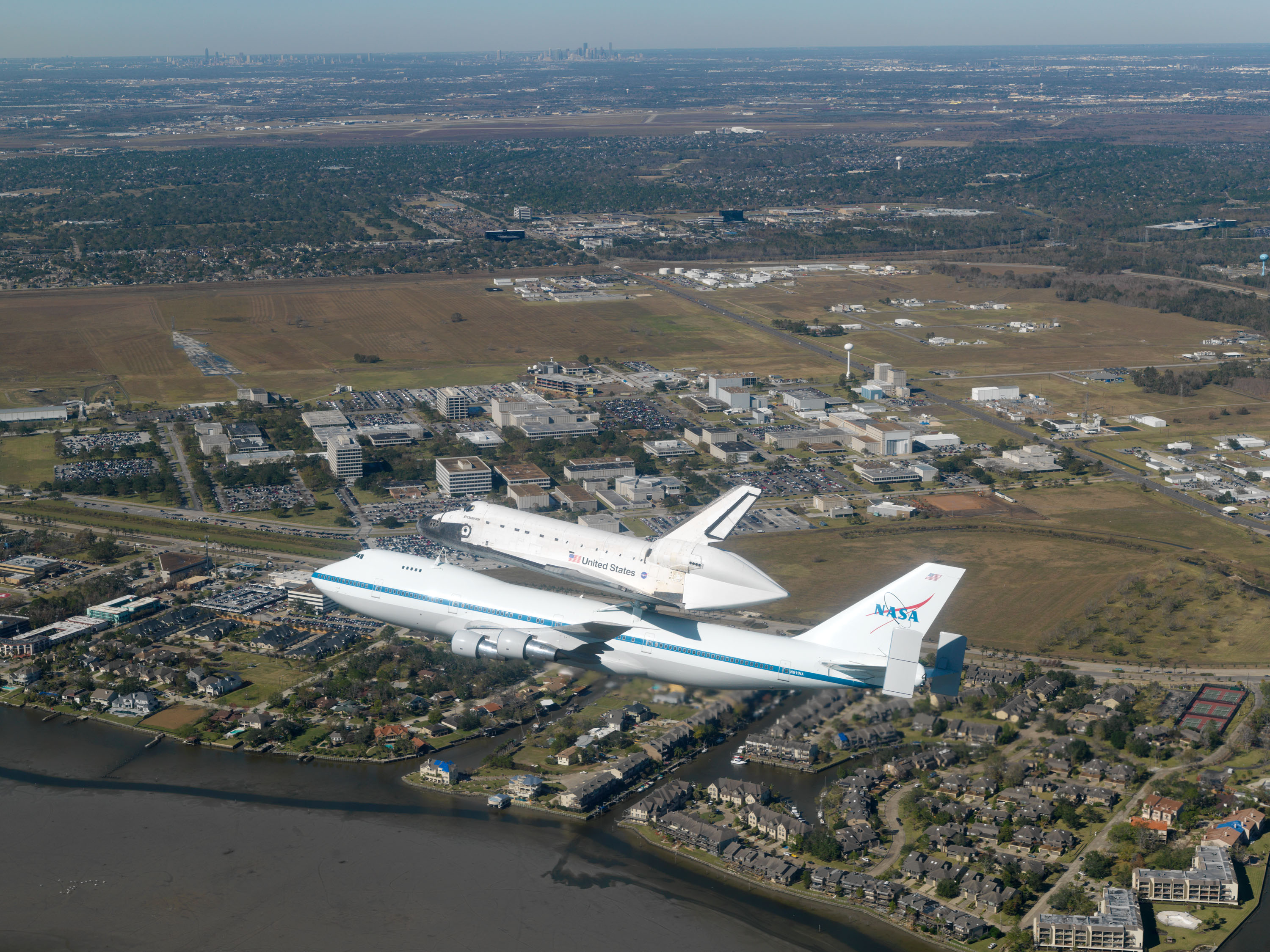 NASA 911 carrying Endeavour over Johnson Space Center after STS-126.